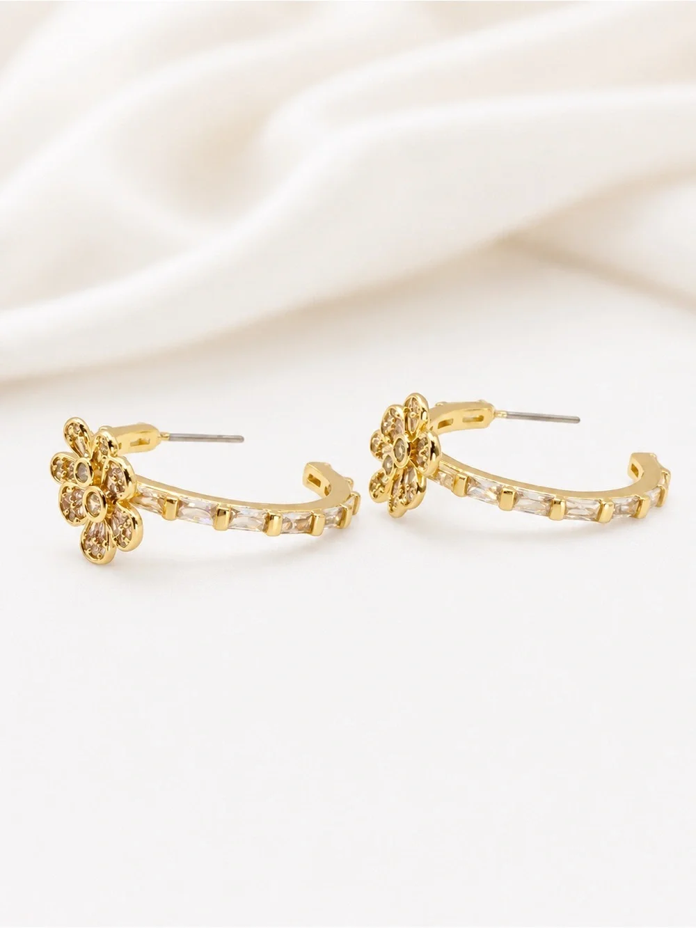 Kate Spade Fleurette Hoops in gold.